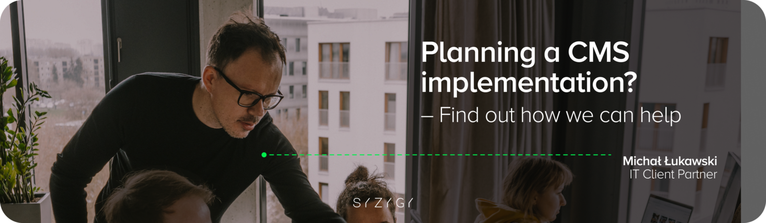 The image shows Michał Łukawski, IT Client Partner, during a meeting with the team discussing a project to implement a content management system (CMS). The graphic features the text ‘Planning a CMS implementation? - Find out how we can help'. The background is a modern office interior with a view of urban buildings. The graphic encourages contact about a request for proposal (RFP) for the implementation of a new CMS, especially for companies looking for scalable and flexible content management solutions.