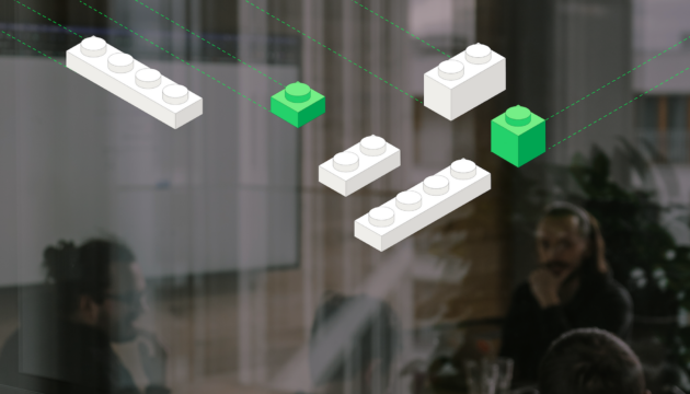 Illustration showing an abstract concept of a modular system. In the background, fragments of figures in an office can be seen, suggesting a business context. In the foreground are graphics of white and green blocks, symbolising the elements of the CMS, which can be freely configured to suit individual user needs.